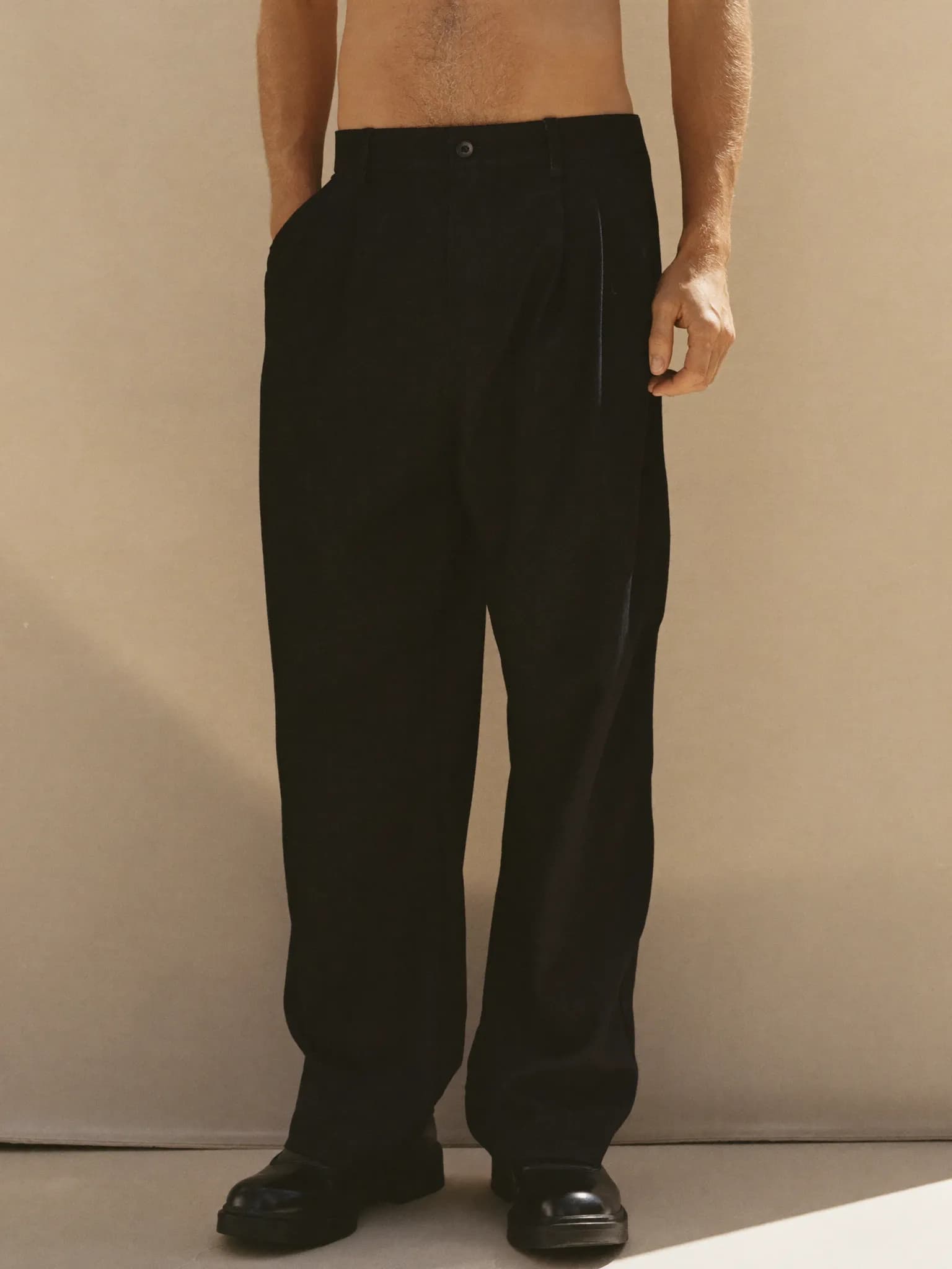 Model wearing the Black Canvas Low-Top.