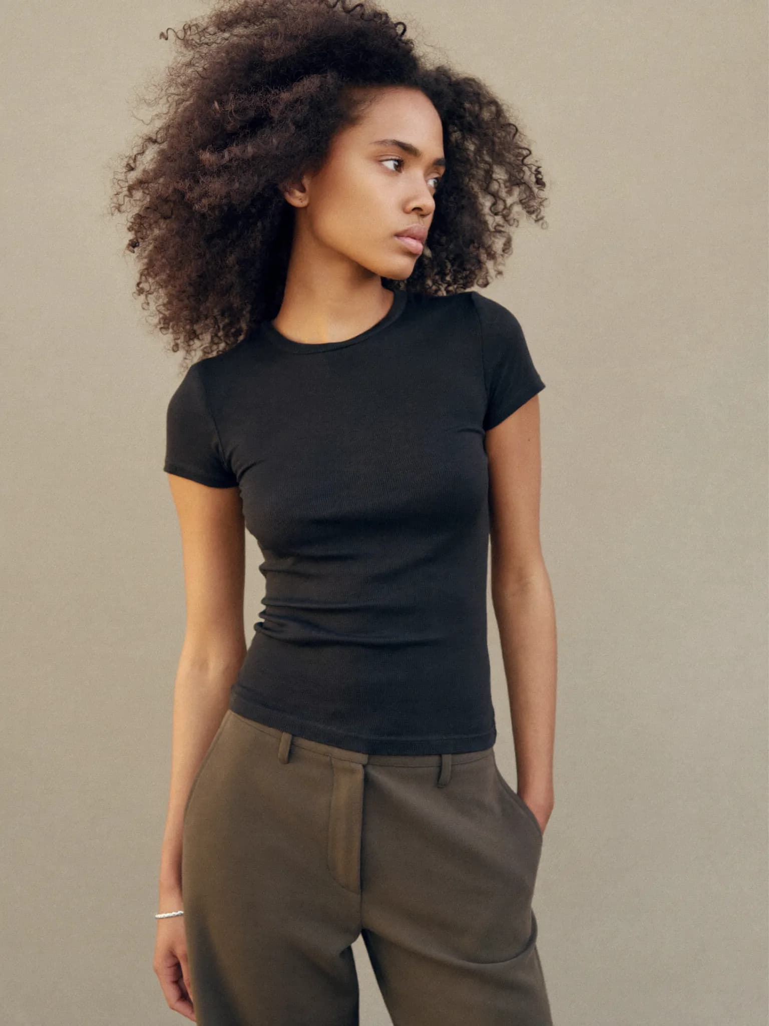 Model wearing the Black Fitted Rib Tee.