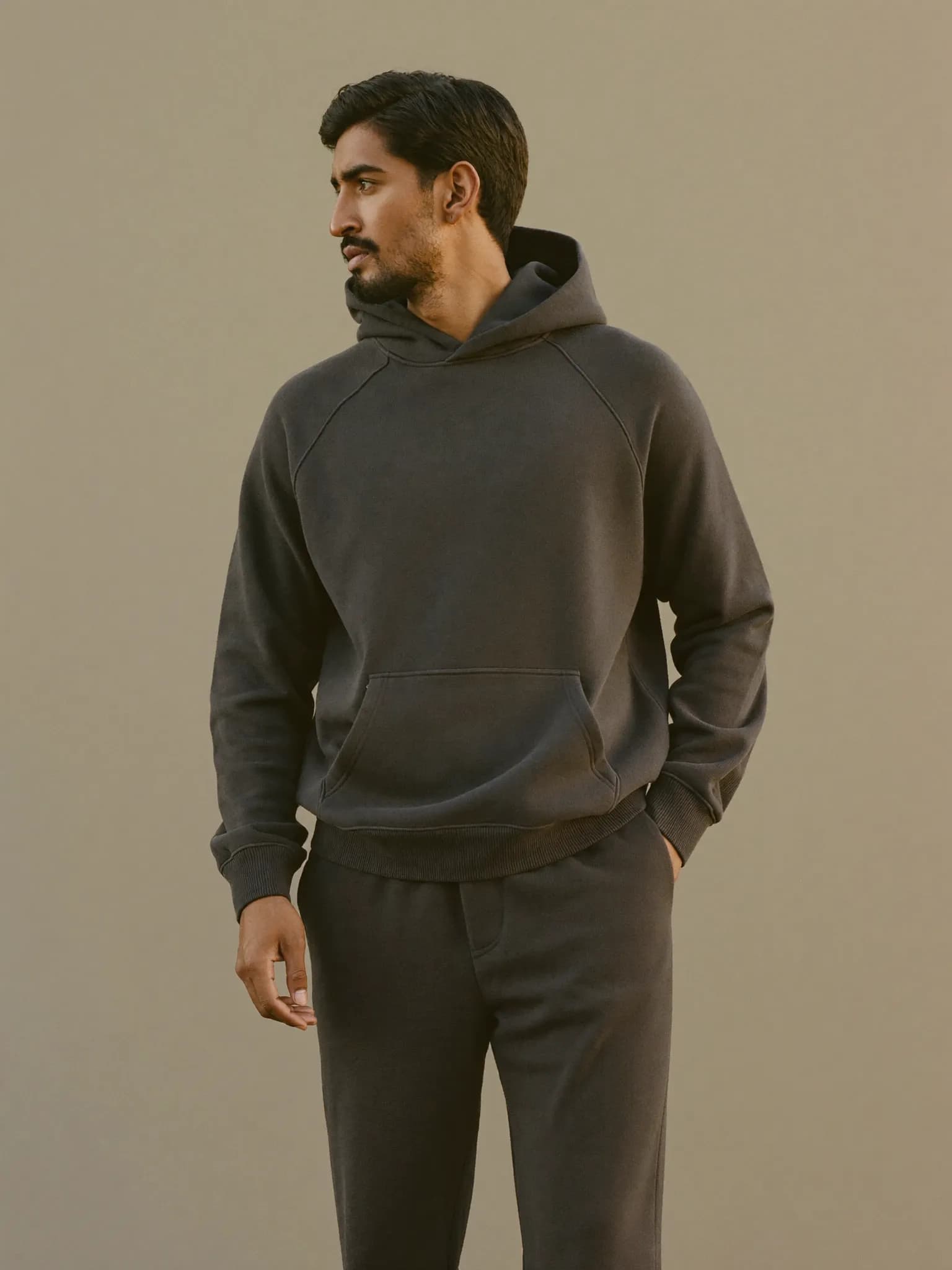 Model wearing the Charcoal Full-Zip Hoodie.