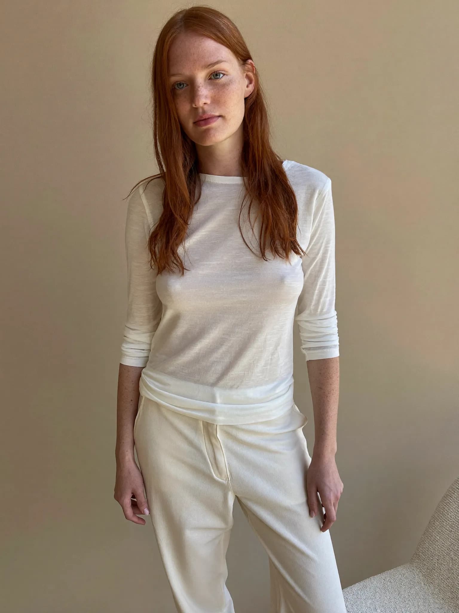 Model wearing the Ivory Long-Sleeve Fitted Tee.