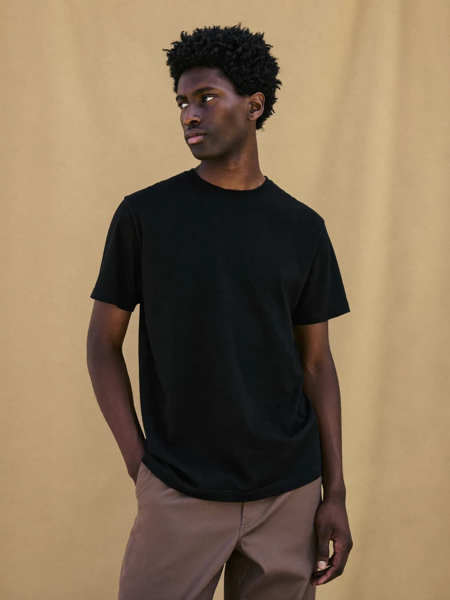 Model wearing the Black Pima Cotton Crew Tee.
