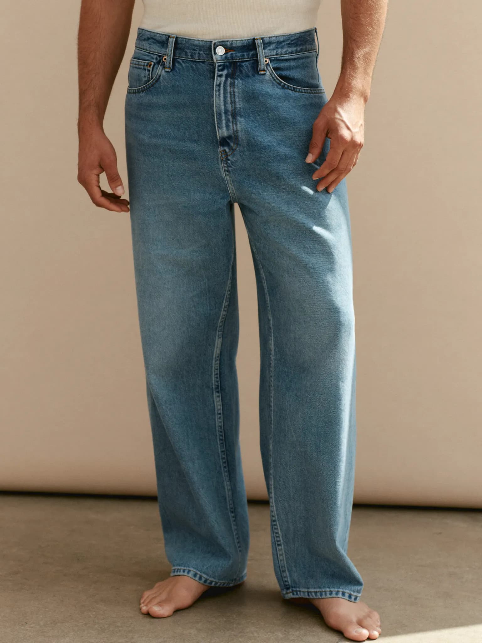 Model wearing the Stone Wash Relaxed Jeans.