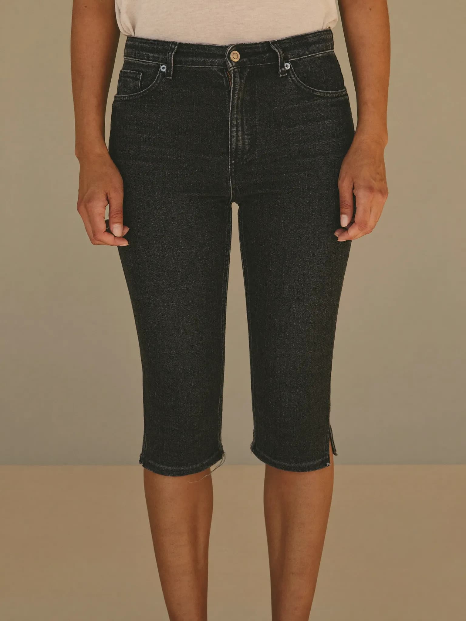 Model wearing the Washed Black Slim Tapered Jeans.