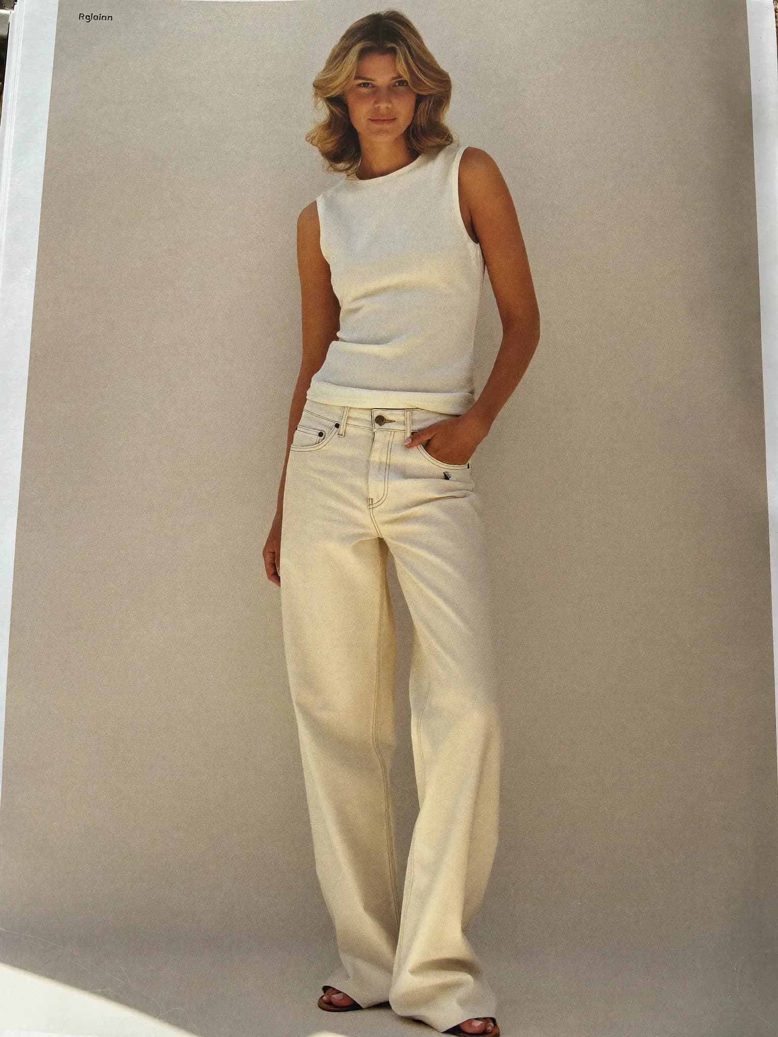 Model wearing the Ecru Wide-Leg Jeans.